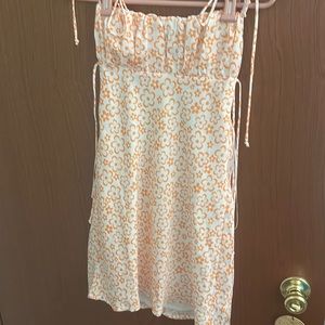 white dress with orange flowers